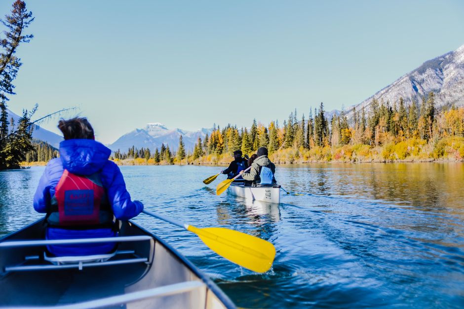Do adults have to wear a life jacket in a canoe, or just carry one?