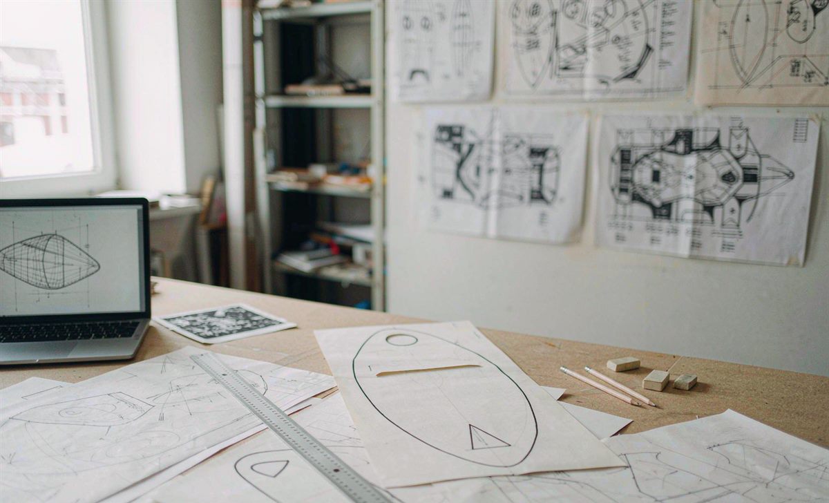 Paper templates and drawings on a product development table